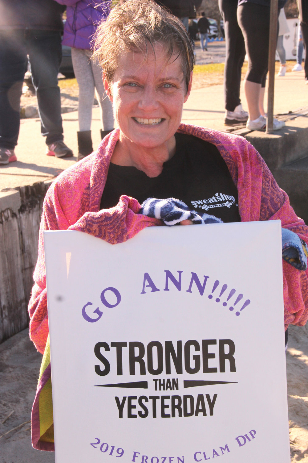 SIGN OF SUPPORT: Ann Altshuler who did the Obstaplunge displays the sign co-workers made for her.